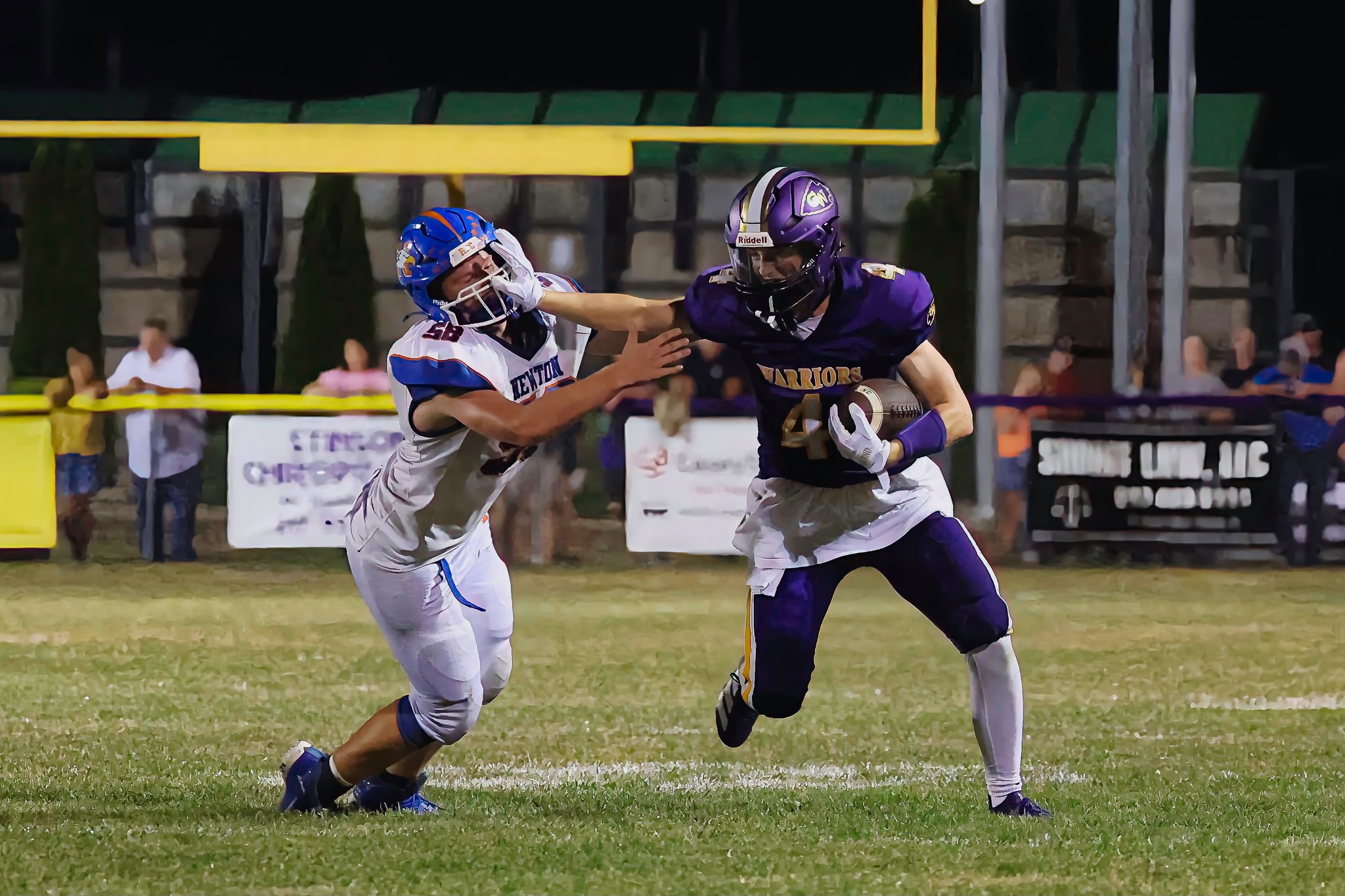 Kellen Sullivan of Casey-Westfield (4) fends off Newton's Dominic Baltzell in a game on Sept. 12th (photo by Dave Rohr).