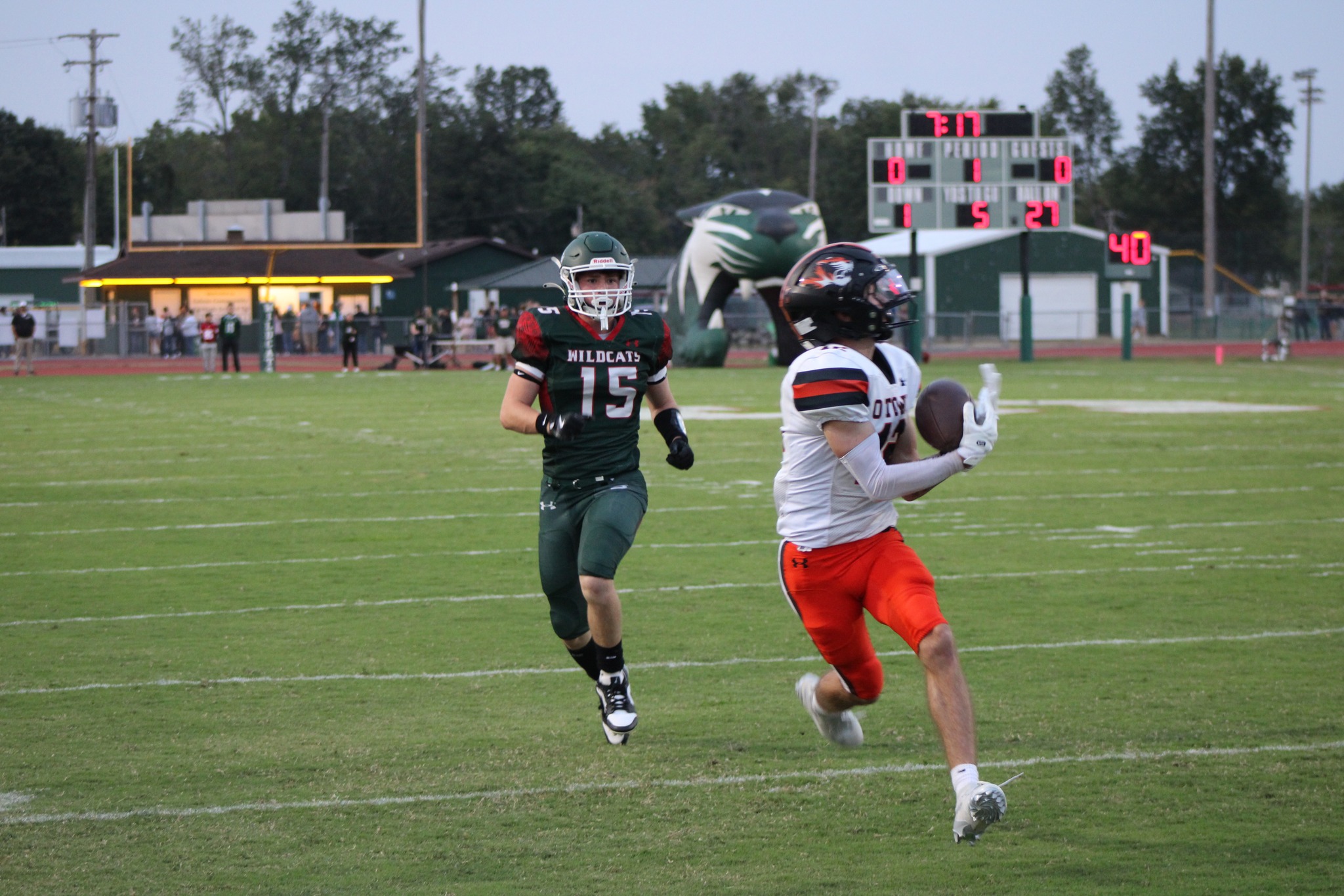Olney's Ian Pianfetti (right) catches a touchdown pass against Salem on Sept. 5. Photo by Hometown Register.