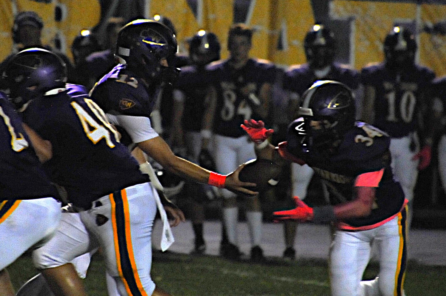 Casey-Westfield quarterback Nolan Clement hands off to Nick Fouty in a game against Marshall on Oct. 3. Photo by Tom Lisella