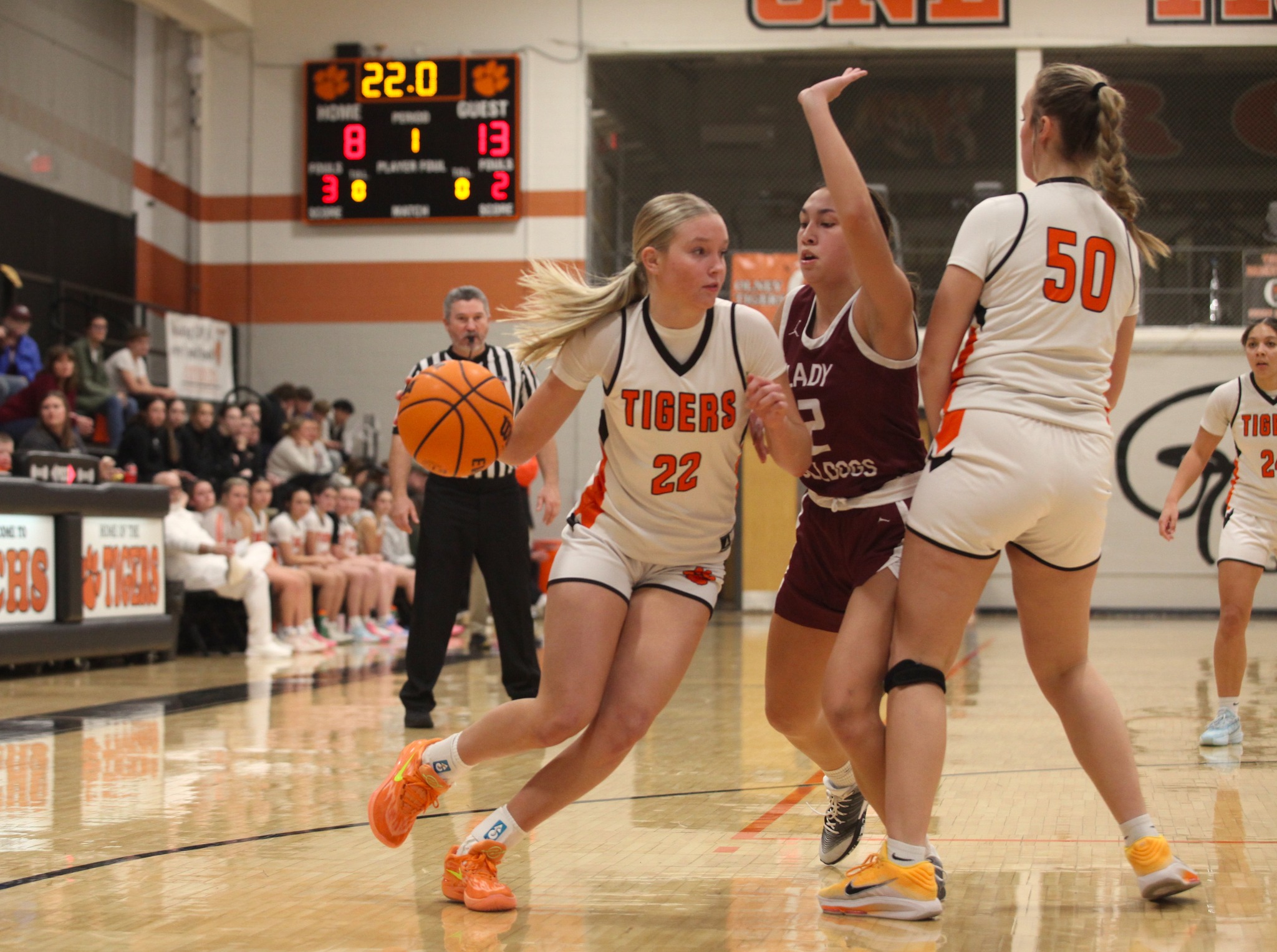 Olney's Addy Gray (22) goes around a pick set by Vivian Schlck  against Carmi (Photo by Hometown Register).