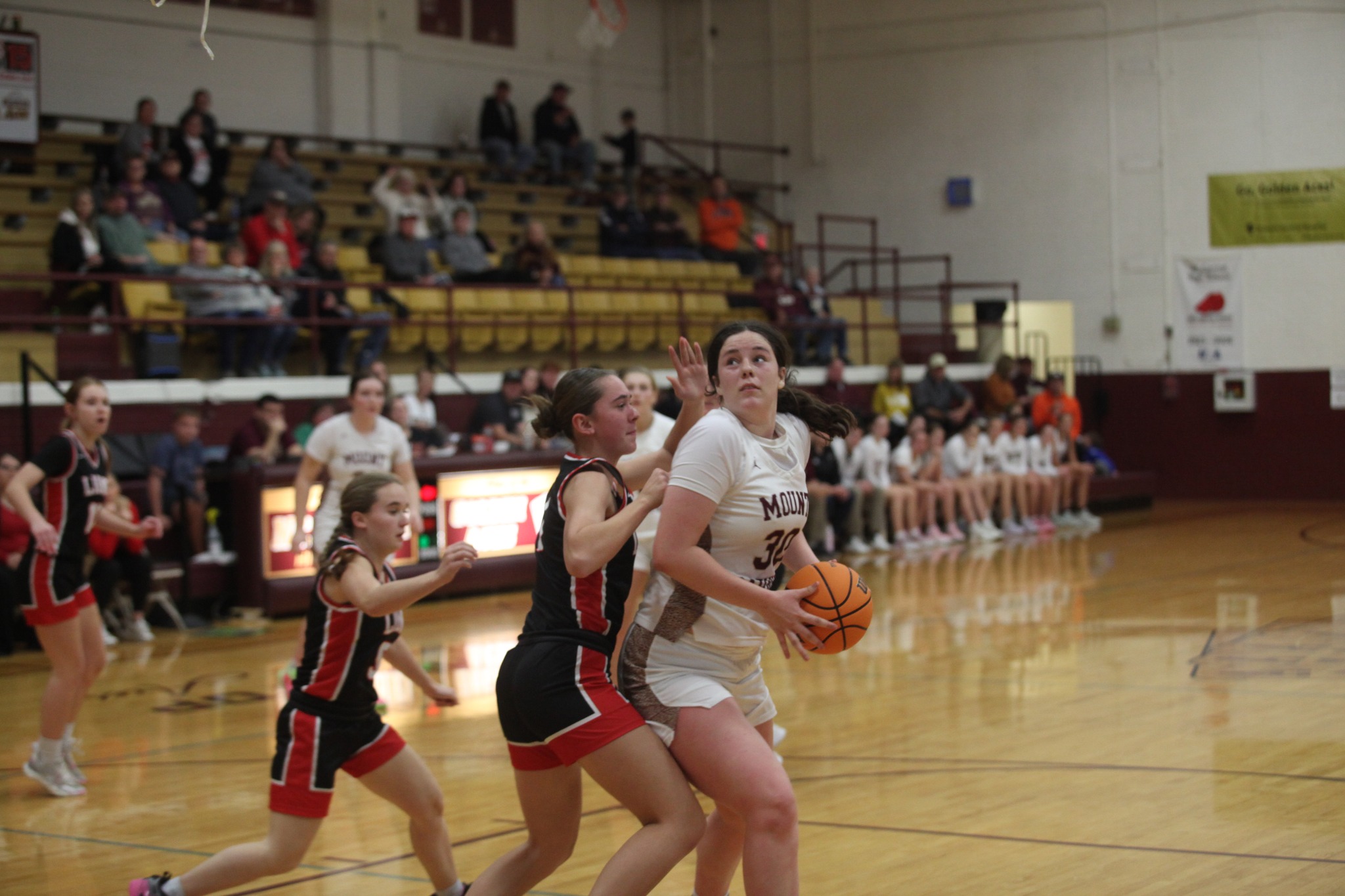 Maycee Randall of Mt. Carmel (30) heads for the basket against Edwards County (Photo by The Hometown Register).