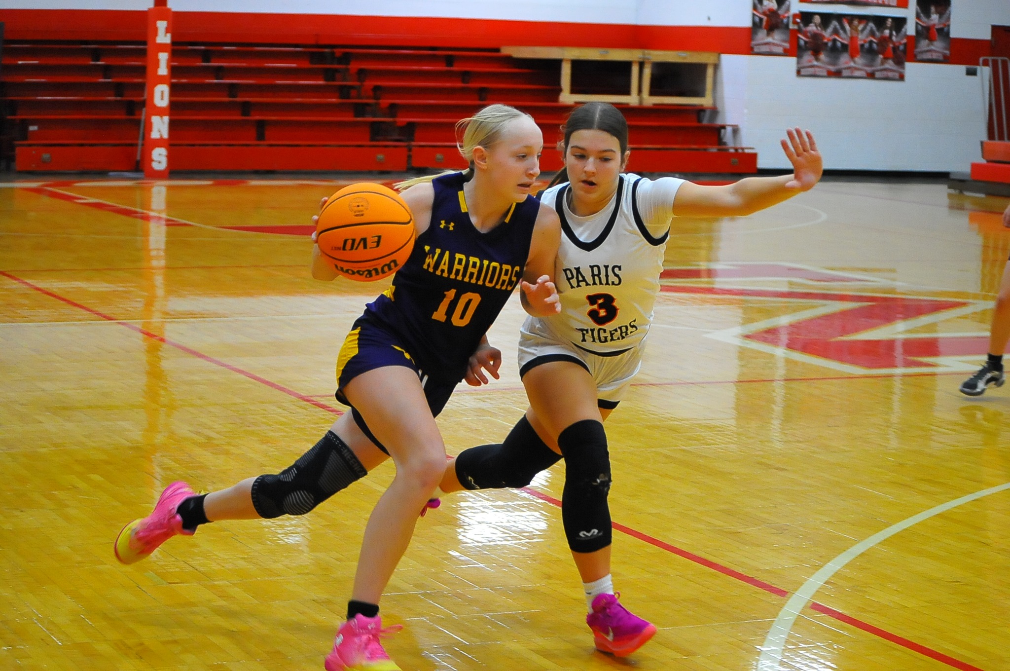 Kennady Fuller (10) of Casey-Westfield drives on Paedyn Keys of Paris during an LIC tournament game on Saturday in Marshall (Photo by Wabash News / Tom Lisella).
