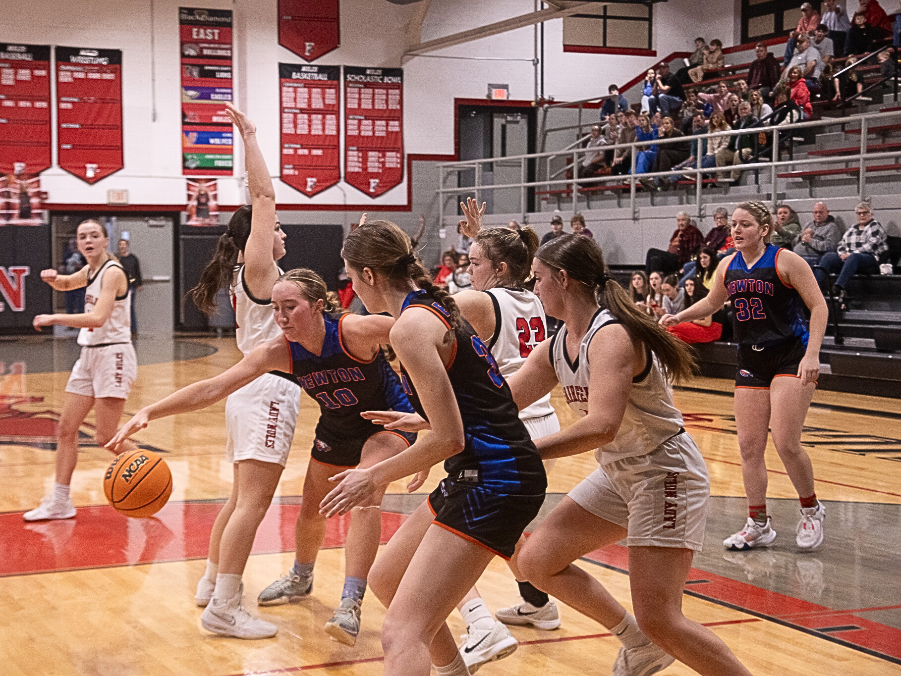 Claire Probst (10) of Newton reaches out to control the ball against Fairfield (Photo by Jasper County Daily News).