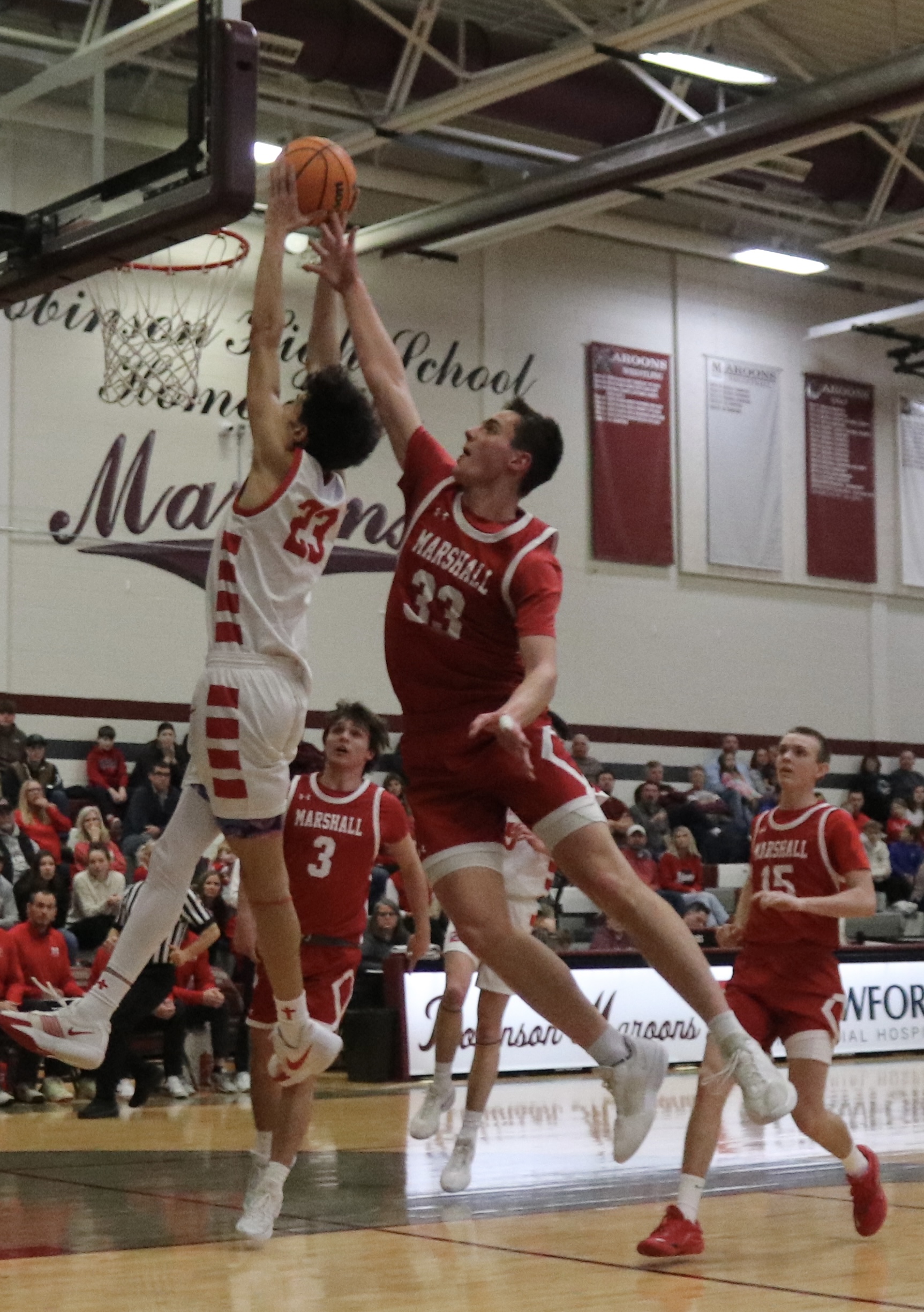 Lawrenceville’s Noah Wilson gets past the Marshall defense for a slam dunk during the semifinals of the Little Illini Conference Tournament Wednesday (Photo by Josh Brown).
