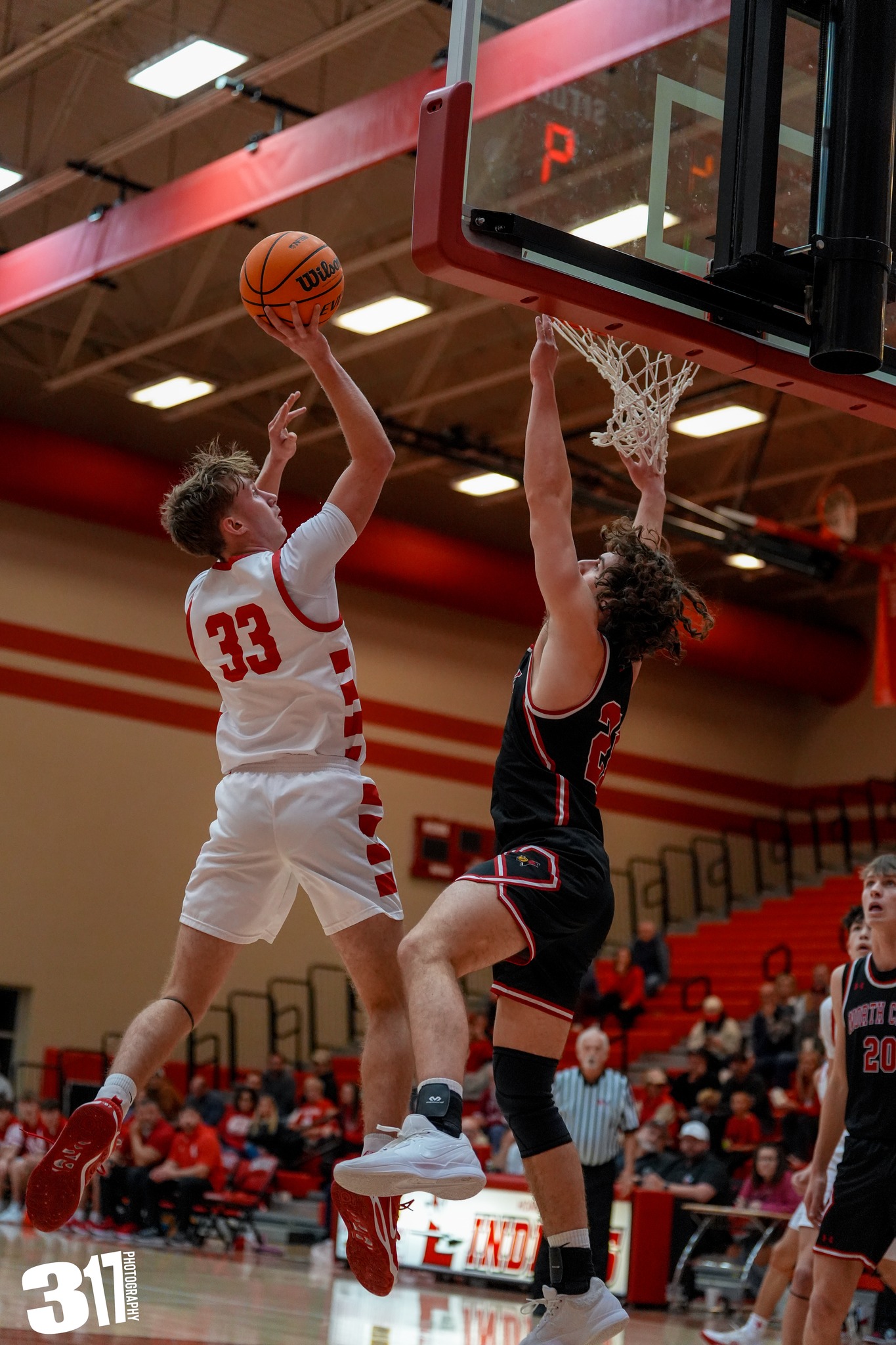 Jacek Mickiewicz (33) of Lawrenceville floats a shot up against North Clay (Photo by 317 Photography).