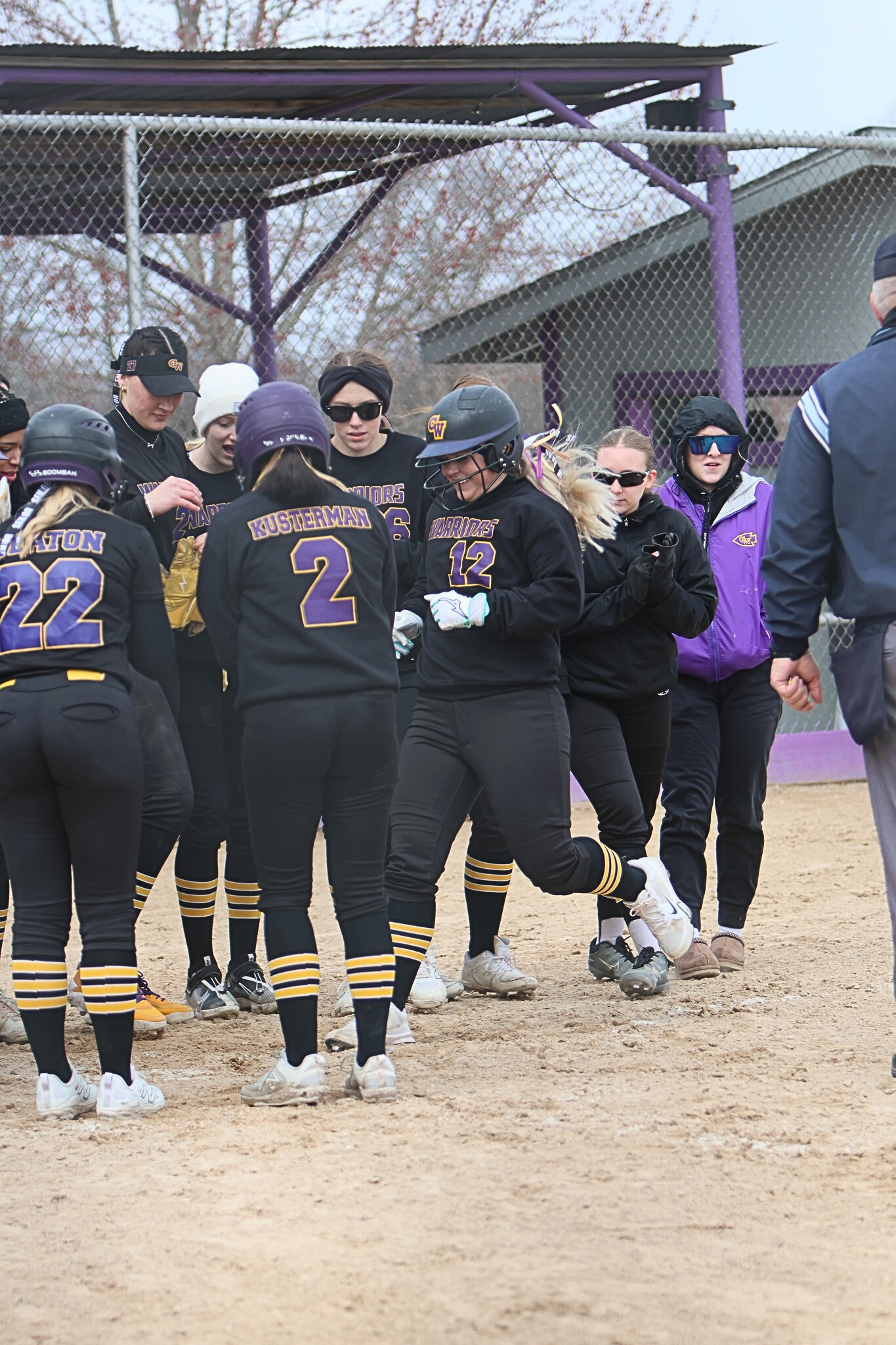 Ava Goble (12) of Casey-Westfield is welcomed at home plate after hitting a grand slam home run vs. St. Thomas More (Photo by Terri Freeman Cox).