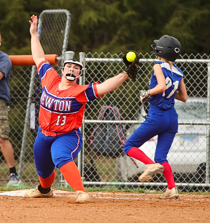 Newton's Audrie Reich stretches to make the out at first base during Tuesday's 13-1 win over Red Hill (Photo by Jasper County Daily News).